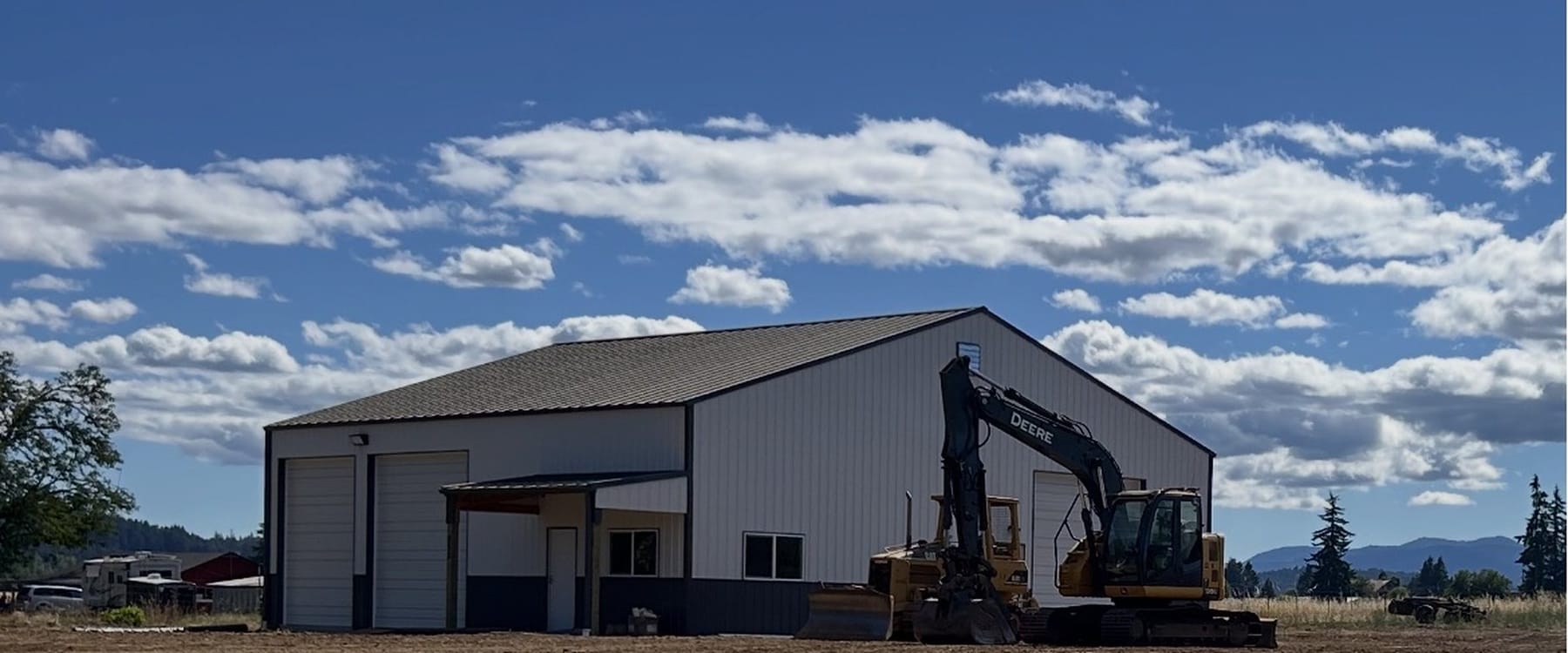 Graded and levelled site in front of a new shop building in the Willamette Valley