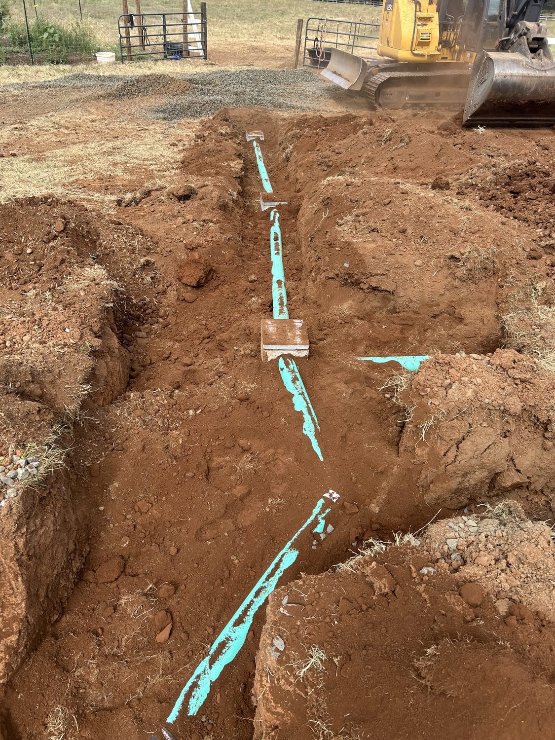 Locates marked and the pipe laid in.